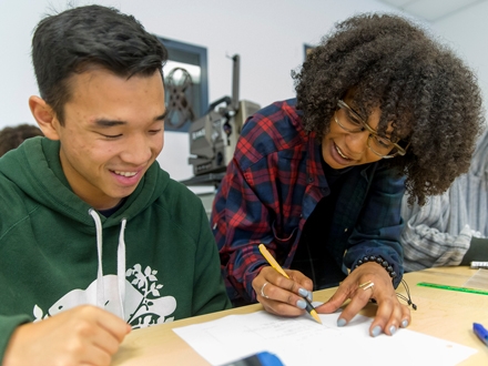 teacher helping a student