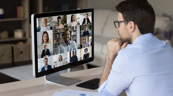 Man attending an Online Meeting with other people